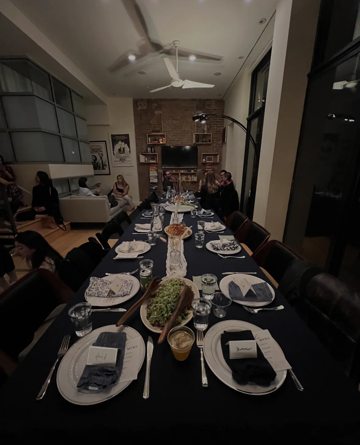 Dinner table with people gathered around